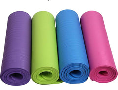 Four rolled-up yoga mats in purple, green, blue, and pink on a white background.