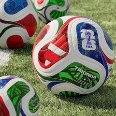 Colorful soccer balls with FIFA and Trionda branding on a grass field
