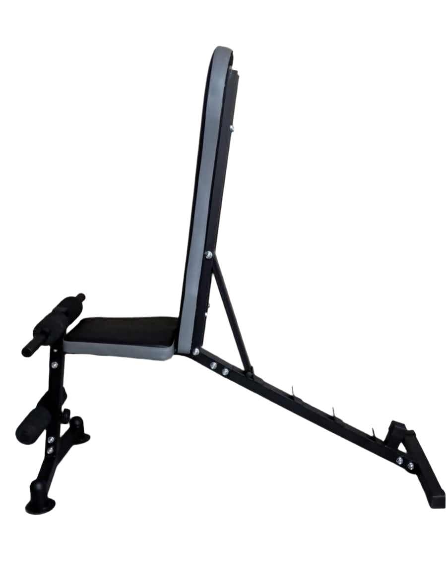 Black weight bench on a gray floor with a wooden wall background